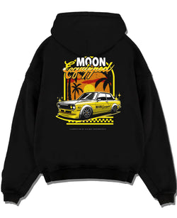 Black pullover hoodie laid flat on a white background, featuring jdm japanese retro vintage racing street performance graphic.
