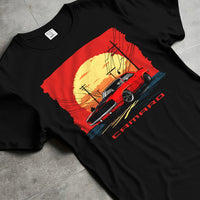 Black T-shirt laid flat with natural fabric folds, featuring racing drag american muscle street vintage classic performance graphic.
