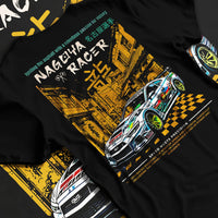 Black T-shirt laid flat with natural fabric folds, featuring racing drift jdm japanese tokyo street tokyo drift enthusiast graphic.