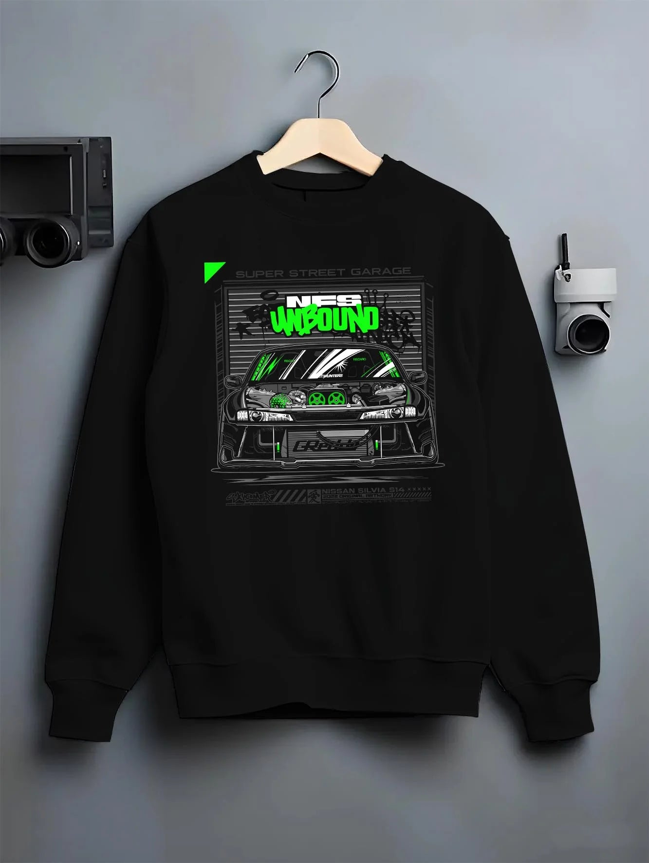 Black crewneck sweatshirt on a hanger against a grey wall, featuring rs race drift motorsport need for speed street speed graphic.