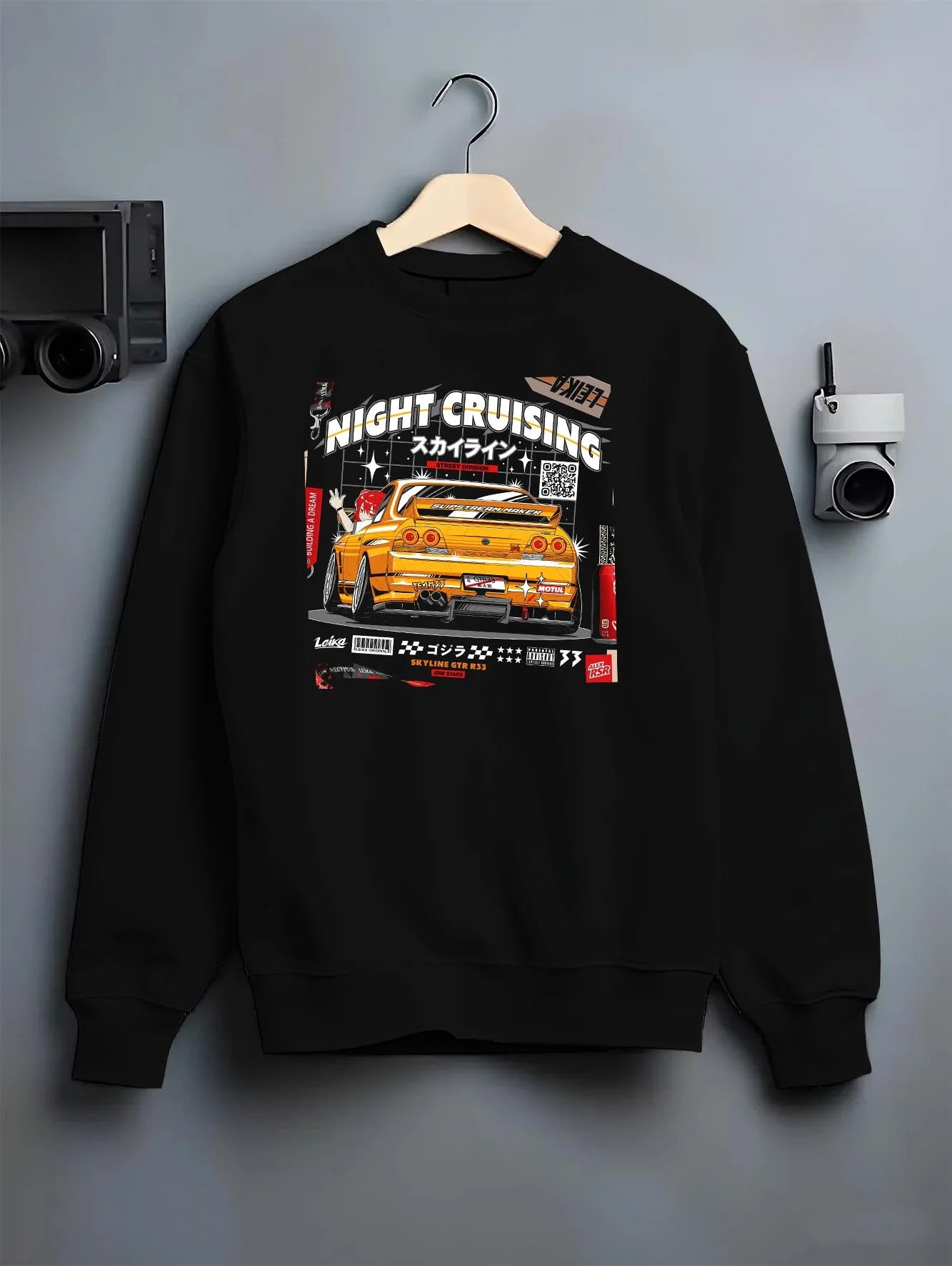 Black crewneck sweatshirt on a hanger against a grey wall, featuring racing drift jdm japanese tokyo street tokyo drift nght01.