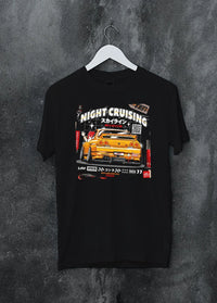 Black crewneck T-shirt on a hanger against a grey wall, featuring racing drift jdm japanese tokyo street tokyo drift graphic.