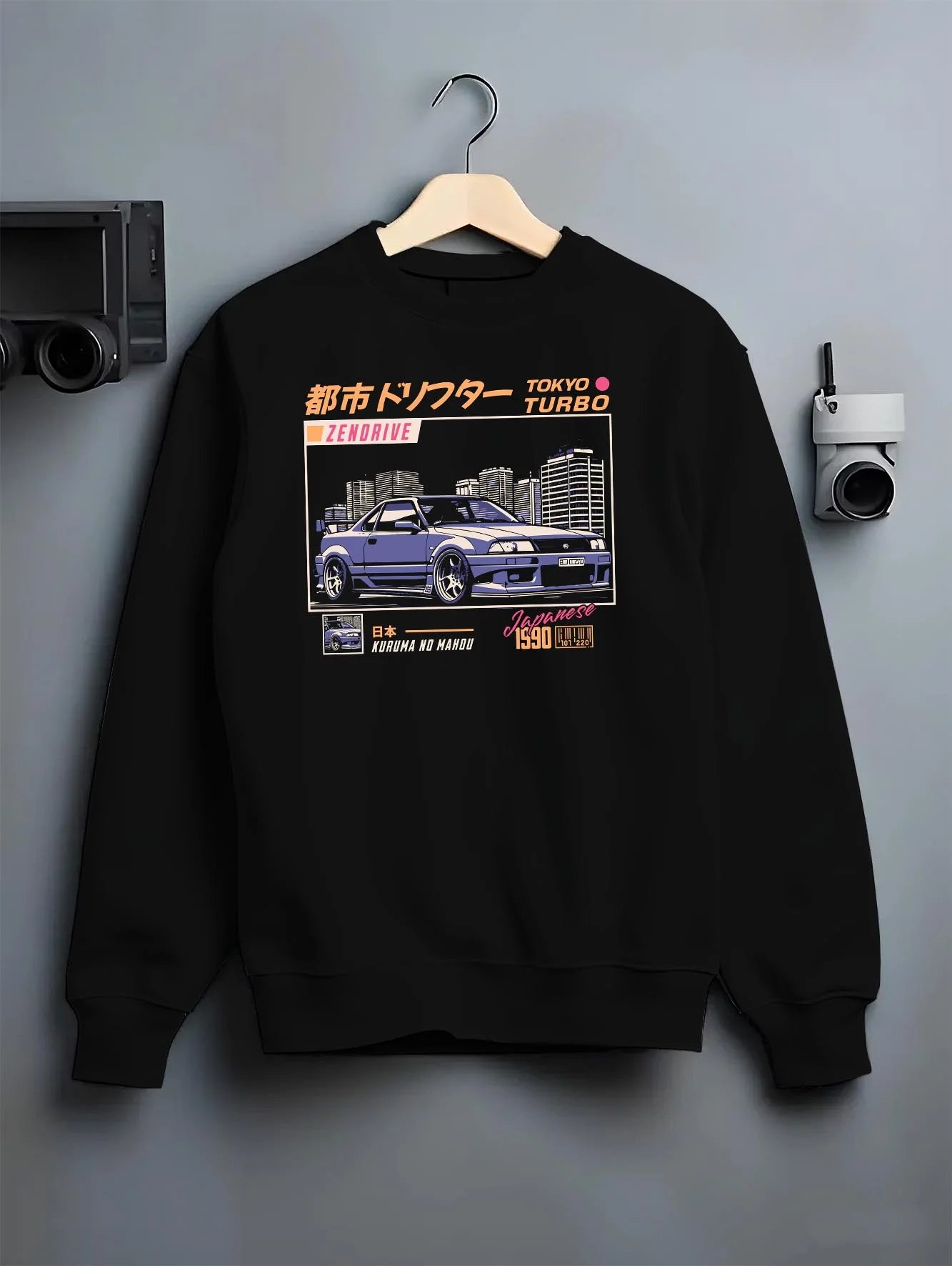 Black crewneck sweatshirt on a hanger against a grey wall, featuring Nissan turbo turbocharged racing drift jdm japanese graphic.