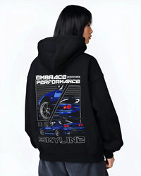 Black hoodie worn by a female model, back view, featuring Nissan Skyline R34 r34 skyline turbo jdm legend racing graphic.
