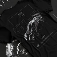 Black T-shirt laid flat with natural fabric folds, featuring Nissan FAIRLADY turbo turbocharged drift jdm japanese tuner graphic.