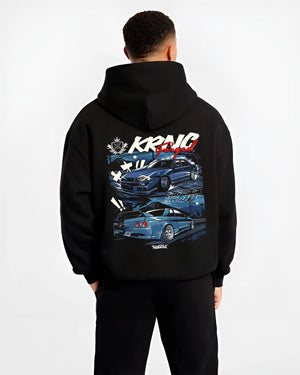 Black hoodie worn by a male model, back view, featuring Nissan Skyline R34 r34 skyline drift jdm legend racing graphic.