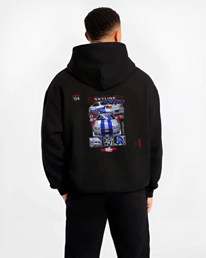 Black hoodie worn by a male model, back view, featuring Nissan Skyline R34 gt r r34 skyline drift jdm racing graphic.