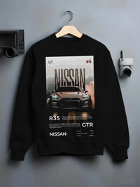 Black crewneck sweatshirt on a hanger against a grey wall, featuring Nissan GT-R R35 gt r r35 turbo racing street legend graphic.