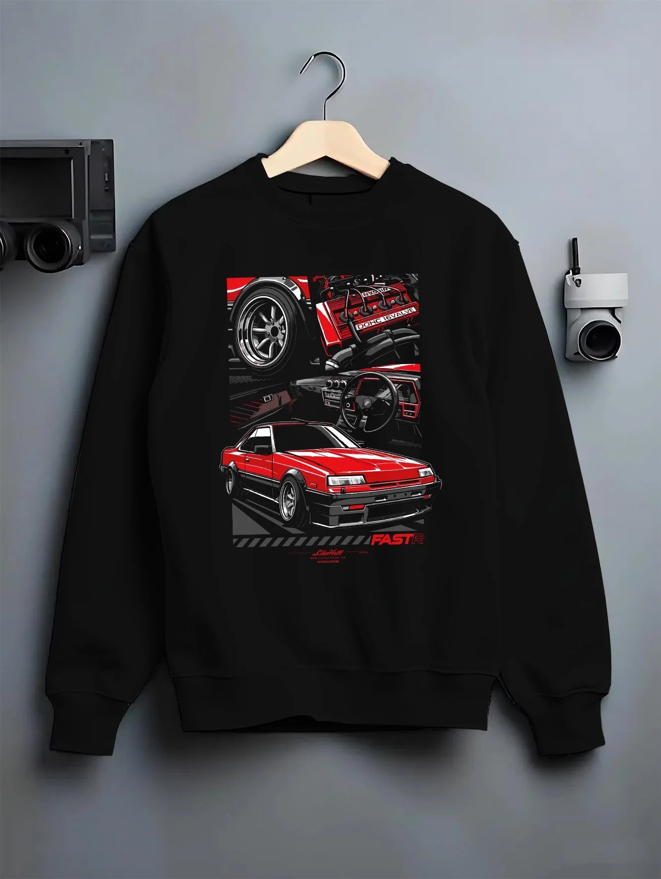 Black crewneck sweatshirt on a hanger against a grey wall, featuring Nissan Silvia turbo turbocharged racing drift jdm graphic.
