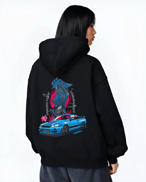 Black hoodie worn by a female model, back view, featuring Nissan Skyline R34 gt r r34 skyline drift jdm japanese street graphic.
