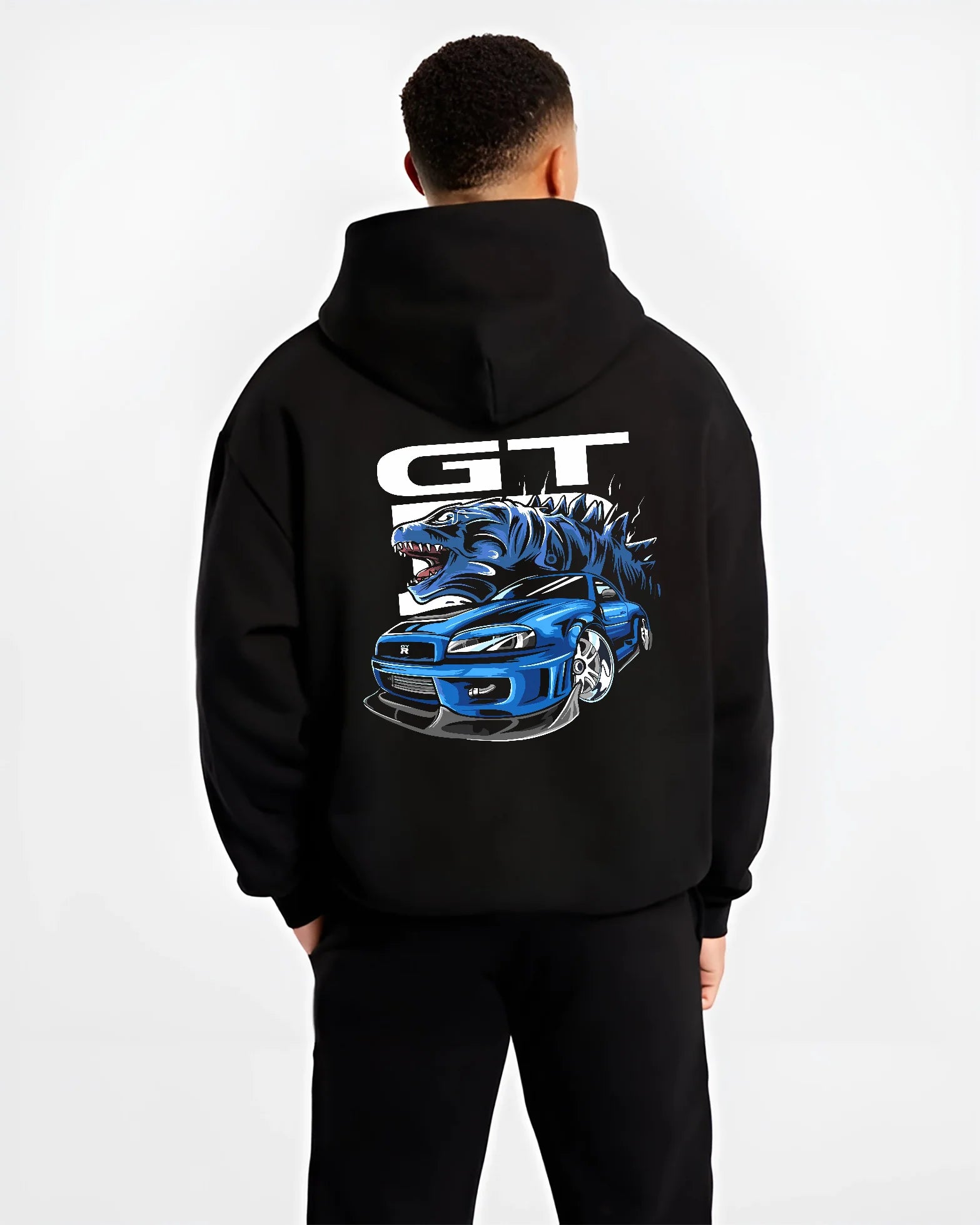 Black hoodie worn by a male model, back view, featuring Nissan GT-R R34 gt r r34 skyline turbo drift jdm japanese street graphic.