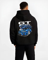 Black hoodie worn by a male model, back view, featuring Nissan GT-R R34 gt r r34 skyline turbo drift jdm japanese street graphic.