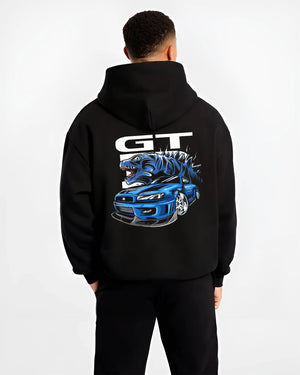 Black hoodie worn by a male model, back view, featuring Nissan GT-R R34 gt r r34 skyline turbo drift jdm japanese street graphic.