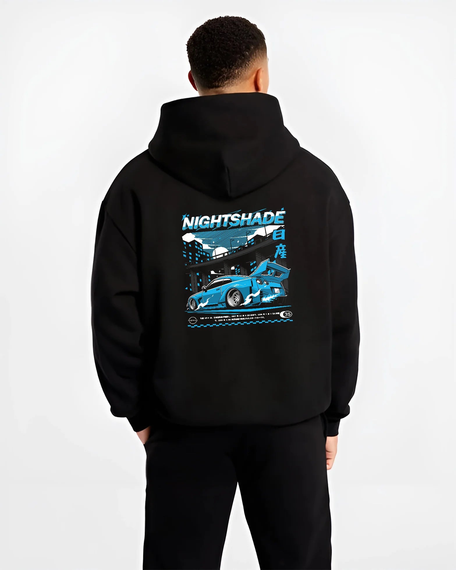 Black hoodie worn by a male model, back view, featuring Nissan GT-R R35 gt r r35 skyline racing drift jdm japanese tokyo graphic.