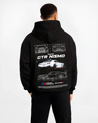 Black hoodie worn by a male model, back view, featuring Nissan Skyline R34 gtr r34 skyline turbo turbocharged racing drift nis7.