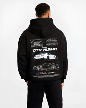 Black hoodie worn by a male model, back view, featuring Nissan Skyline R34 gtr r34 skyline turbo turbocharged racing drift nis7.
