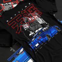 Black T-shirt laid flat with natural fabric folds, featuring Nissan GT-R gt r turbo turbocharged racing drift jdm japanese graphic.