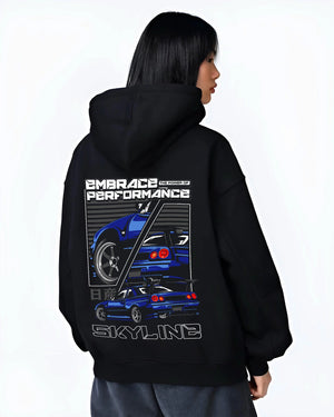 Black hoodie worn by a female model, back view, featuring Nissan SKYLINE r32 turbo turbocharged racing drift jdm street graphic.
