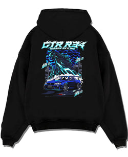 Black pullover hoodie laid flat on a white background, featuring Nissan Skyline R34 gtr r34 skyline racing drift jdm graphic.