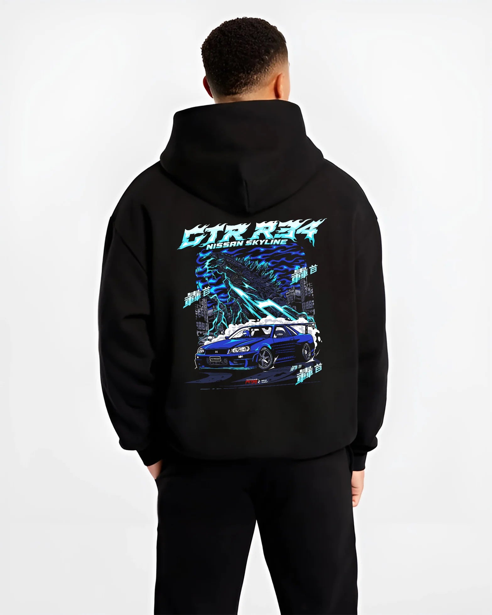 Black hoodie worn by a male model, back view, featuring Nissan Skyline R34 gtr r34 skyline racing drift jdm japanese tuner graphic.