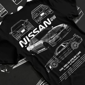 Black T-shirt laid flat with natural fabric folds, featuring Nissan Skyline R34 gtr r34 skyline drift jdm japanese tuner graphic.