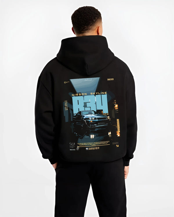 Black hoodie worn by a male model, back view, featuring Nissan Skyline R34 r34 skyline turbo racing drift jdm japanese graphic.