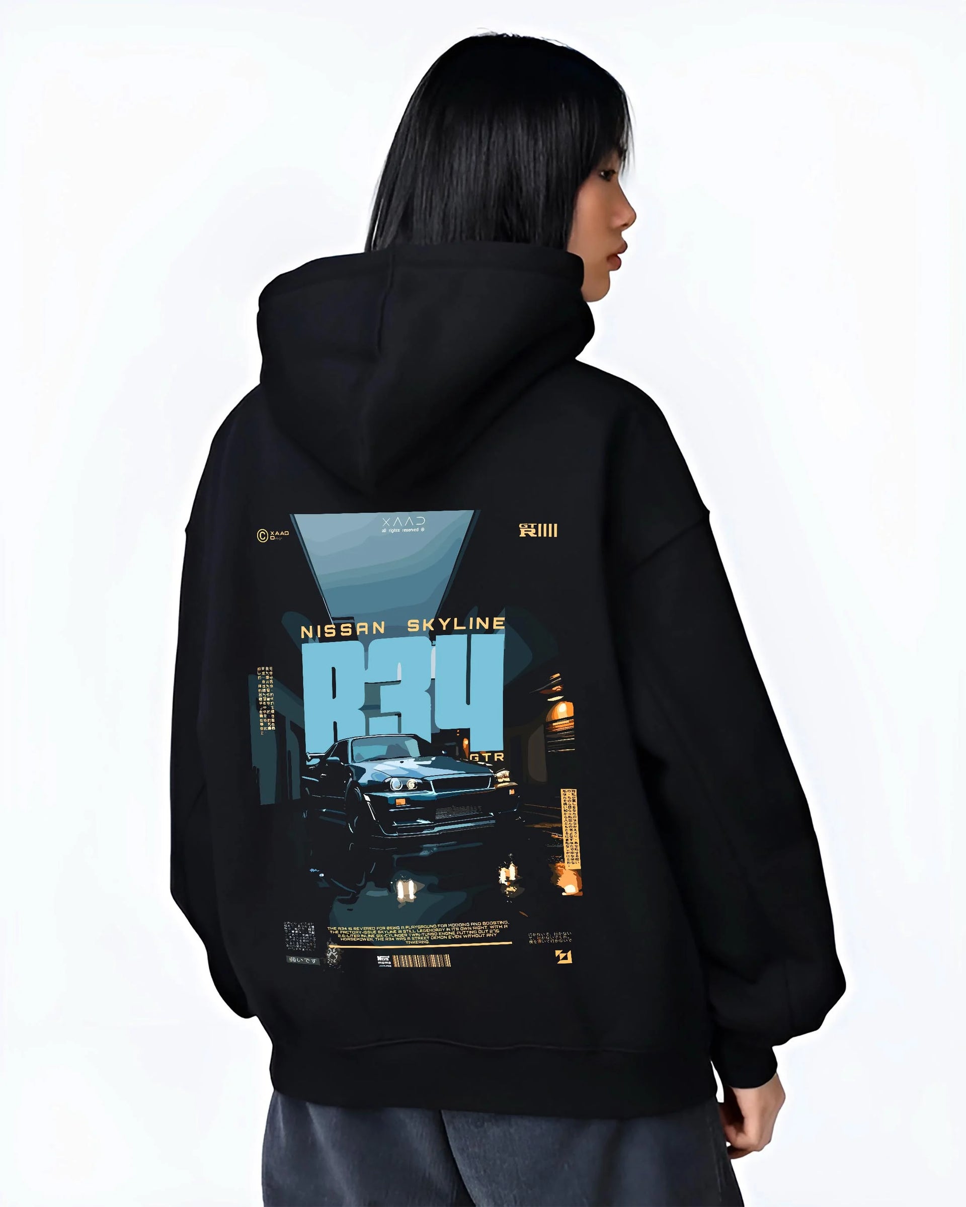 Black hoodie worn by a female model, back view, featuring Nissan Skyline R34 r34 skyline turbo racing drift jdm japanese graphic.