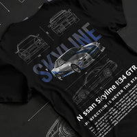 Black T-shirt laid flat with natural fabric folds, featuring Nissan Skyline R34 r34 skyline drift jdm japanese tuner graphic.