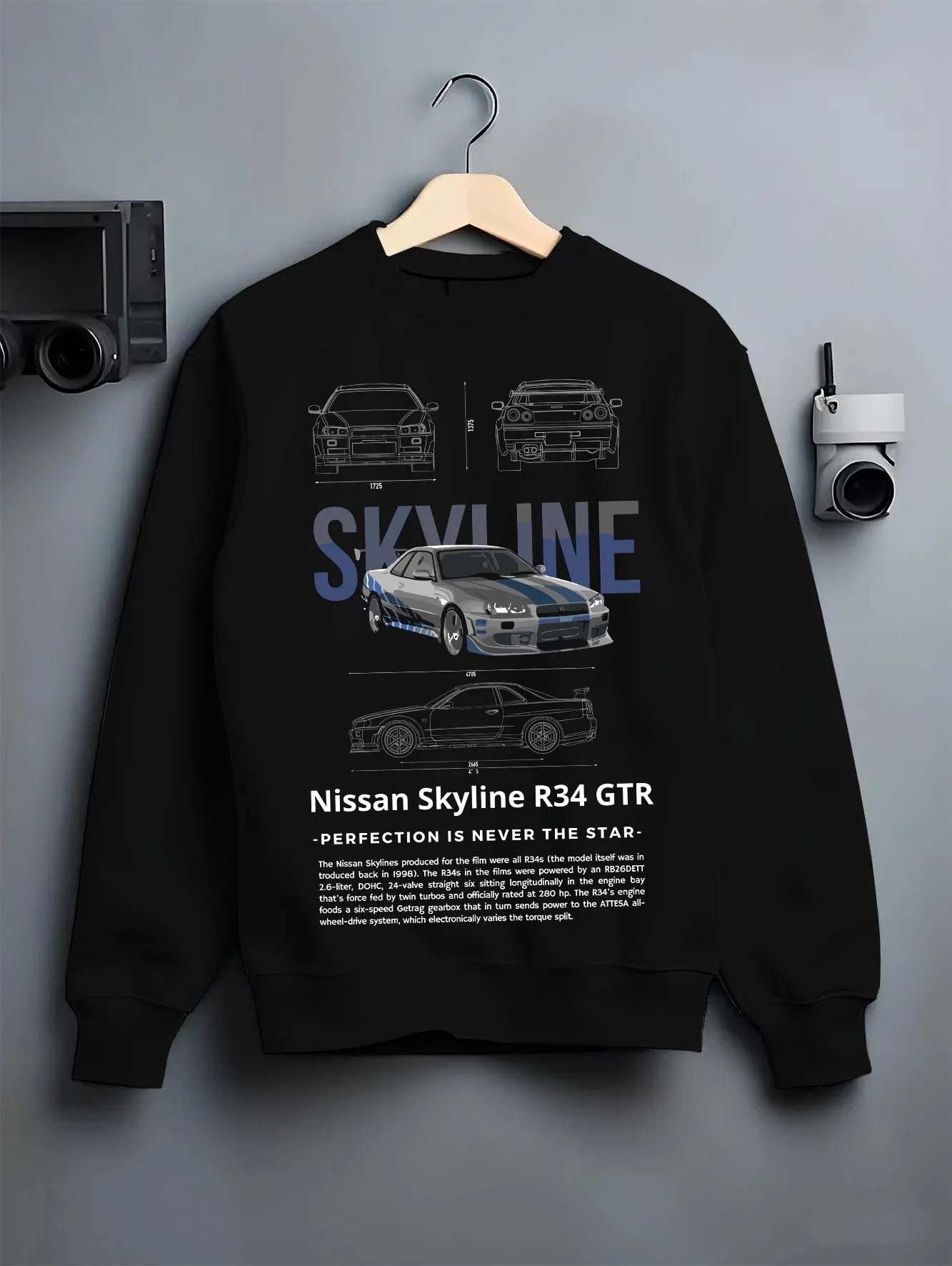 Black crewneck sweatshirt on a hanger against a grey wall, featuring Nissan Skyline R34 r34 skyline drift jdm japanese graphic.