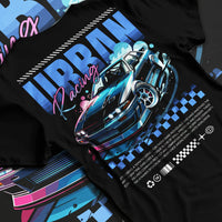 Black T-shirt laid flat with natural fabric folds, featuring Nissan Skyline racing drift jdm japanese street retro graphic.