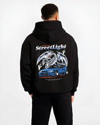 Black hoodie worn by a male model, back view, featuring Nissan Skyline R34 rs r34 skyline turbo racing drift motorsport jdm graphic.