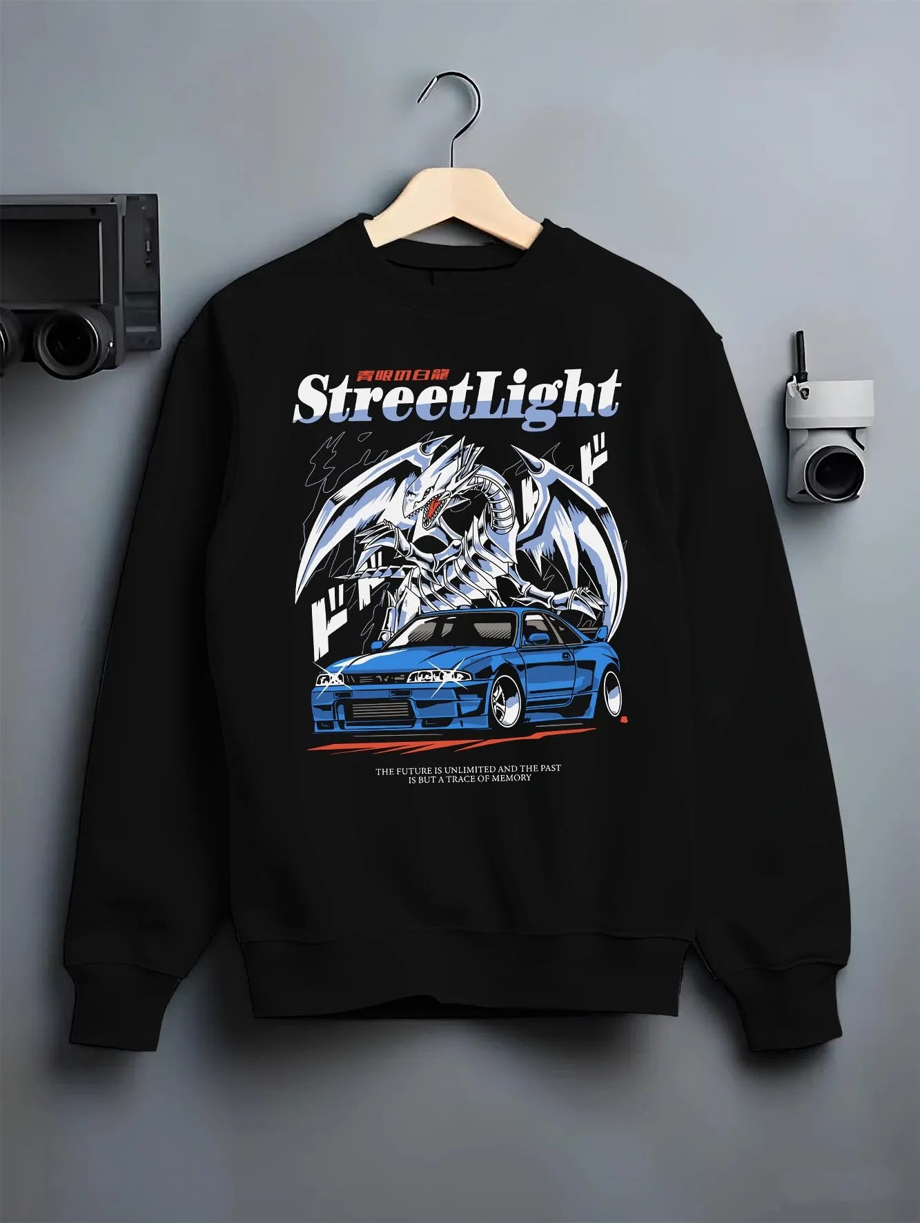 Black crewneck sweatshirt on a hanger against a grey wall, featuring Nissan Skyline R34 rs r34 skyline turbo racing drift graphic.