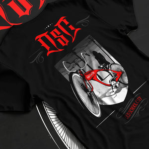 Black T-shirt laid flat with natural fabric folds, featuring street retro racing performance motorsport automotive osclwb.