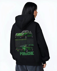 Black hoodie worn by a female model, back view, featuring Porsche 911 rs street retro vintage classic enthusiast graphic.