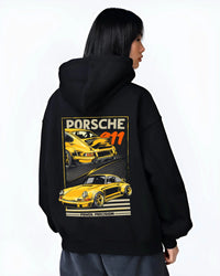 Black hoodie worn by a female model, back view, featuring Porsche 911 rs racing motorsport street retro vintage classic graphic.