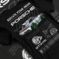Black T-shirt laid flat with natural fabric folds, featuring Porsche Boxster rs racing german tuner street classic graphic.