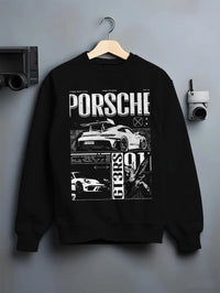 Black crewneck sweatshirt on a hanger against a grey wall, featuring Porsche Cayman rs turbo turbocharged racing german graphic.