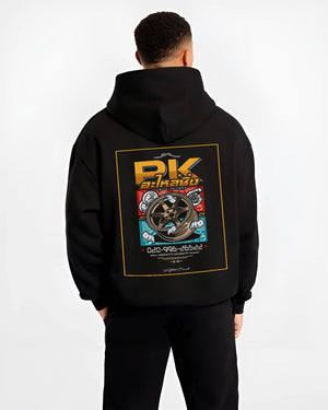 Black hoodie worn by a male model, back view, featuring street racing performance motorsport automotive enthusiast power pkauto.