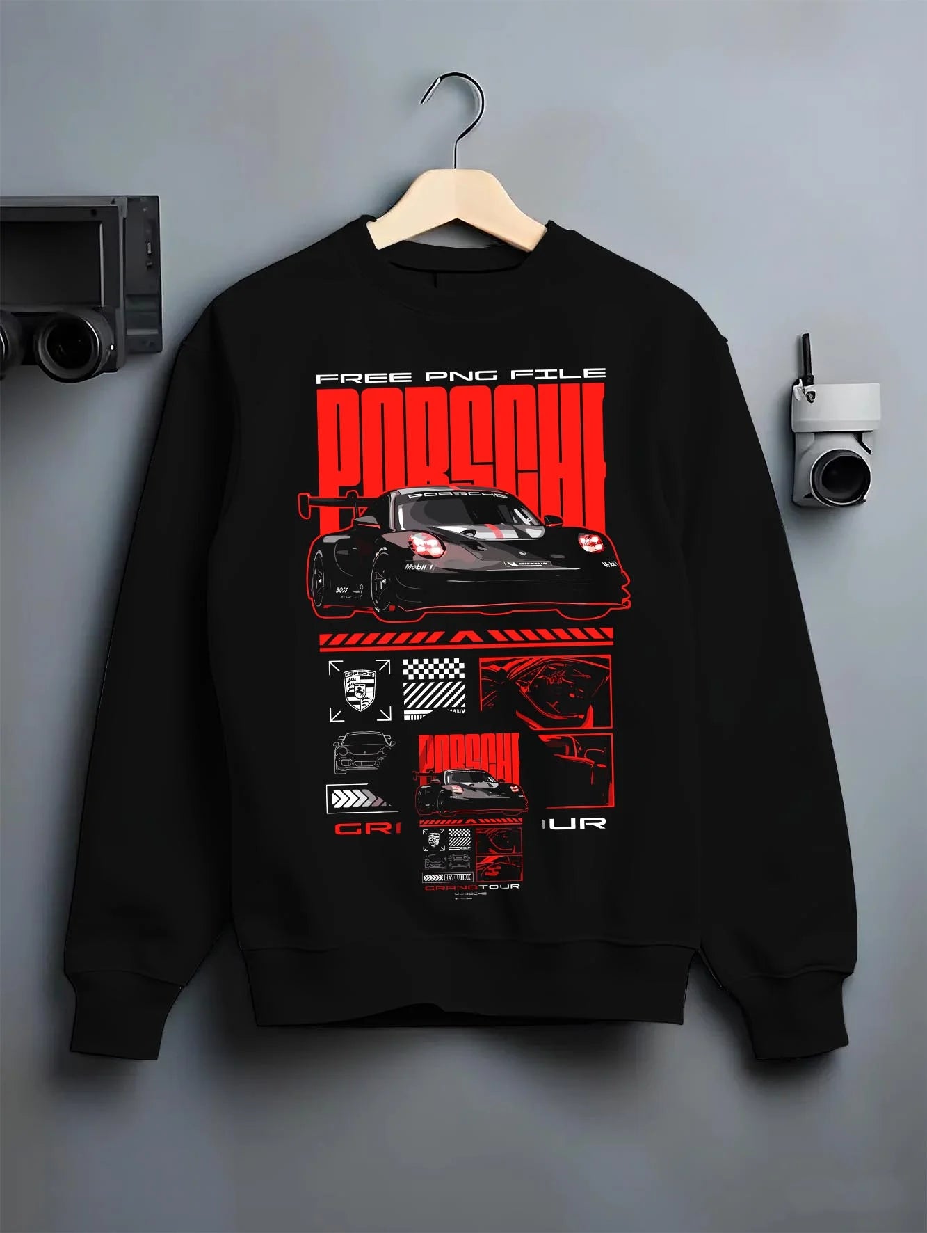 Black crewneck sweatshirt on a hanger against a grey wall, featuring Porsche rs racing race motorsport jdm german street graphic.