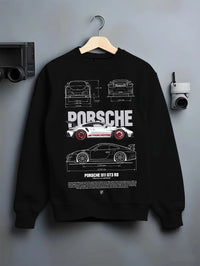 Black crewneck sweatshirt on a hanger against a grey wall, featuring Porsche Panamera rs turbo turbocharged racing german graphic.