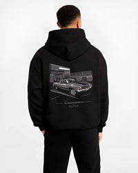 Black hoodie worn by a male model, back view, featuring CHEVROLET muscle retro classic enthusiast racing street performance graphic.