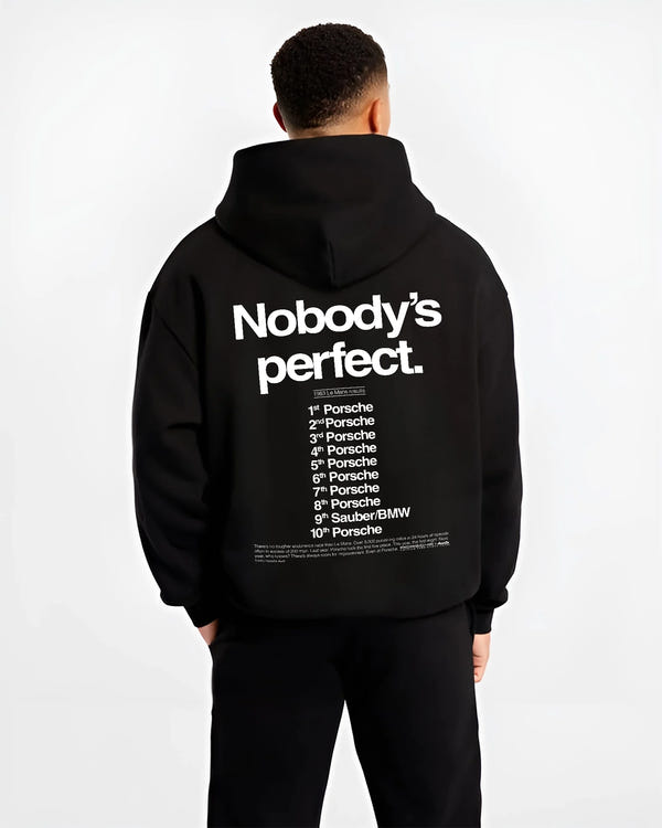 Black hoodie worn by a male model, back view, featuring Porsche rs racing le mans motorsport street performance automotive graphic.