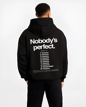 Black hoodie worn by a male model, back view, featuring Porsche rs racing le mans motorsport street performance automotive graphic.
