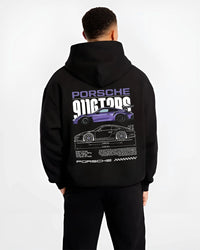 Black hoodie worn by a male model, back view, featuring Porsche Taycan rs turbo turbocharged racing german tuner street graphic.