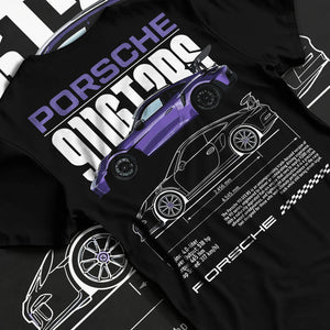 Black T-shirt laid flat with natural fabric folds, featuring Porsche Taycan rs turbo turbocharged racing german tuner graphic.