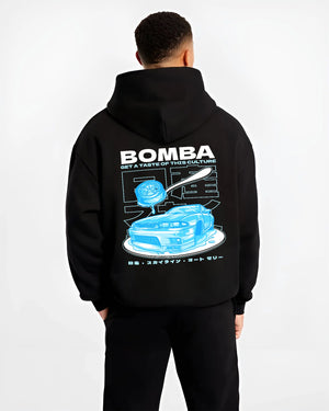 Black hoodie worn by a male model, back view, featuring Nissan Skyline R33 r33 skyline turbo turbocharged racing drift jdm graphic.