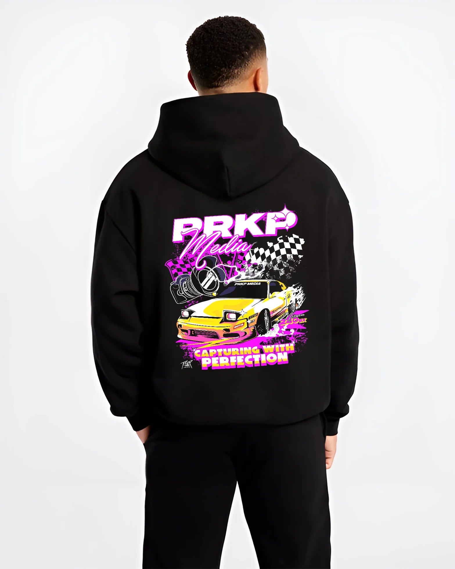 Black hoodie worn by a male model, back view, featuring Nissan Skyline R34 gt r r34 skyline racing drift jdm japanese tuner graphic.