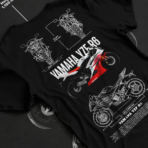 Black T-shirt laid flat with natural fabric folds, featuring Yamaha R6 racing street enthusiast performance motorsport graphic.