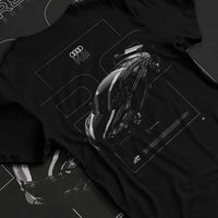 Black T-shirt laid flat with natural fabric folds, featuring Audi R8 turbo racing german street performance motorsport graphic.