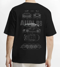 Black T-shirt worn by a male model, back view, featuring Audi R8 v10 racing german street performance motorsport graphic.